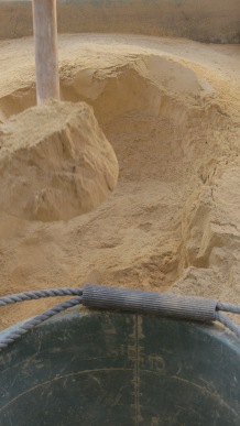 After sifting, the clay gets measured into a measuring bucket that has the liters marked up to 10.